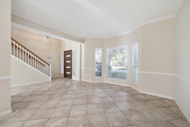 entrance foyer with crown molding and light tile patterned floors