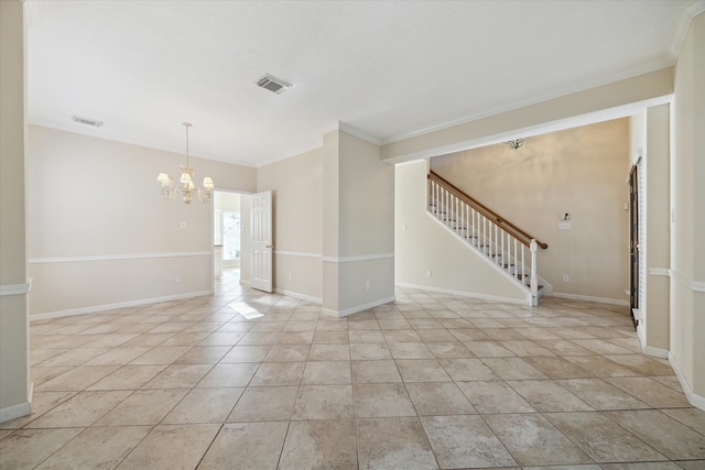 spare room with a chandelier and crown molding