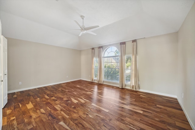 unfurnished room with lofted ceiling, ceiling fan, and dark wood-type flooring