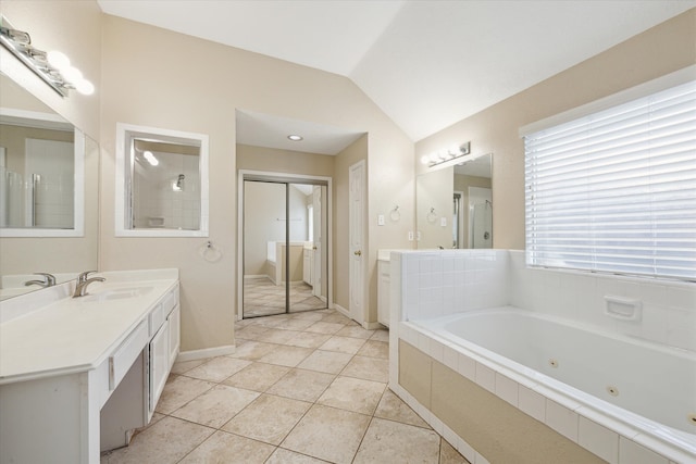 bathroom featuring tile patterned floors, plus walk in shower, vanity, and vaulted ceiling