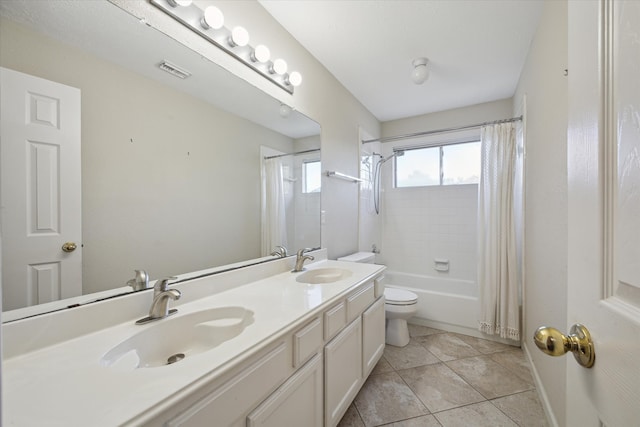 full bathroom with toilet, vanity, tile patterned floors, and shower / bath combo with shower curtain