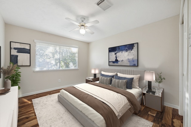 bedroom featuring ceiling fan and dark hardwood / wood-style flooring