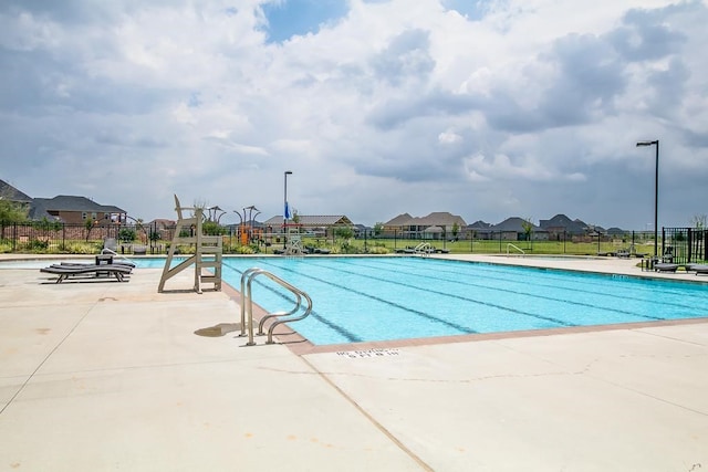 view of swimming pool with a patio