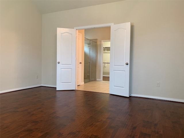 unfurnished room with hardwood / wood-style floors