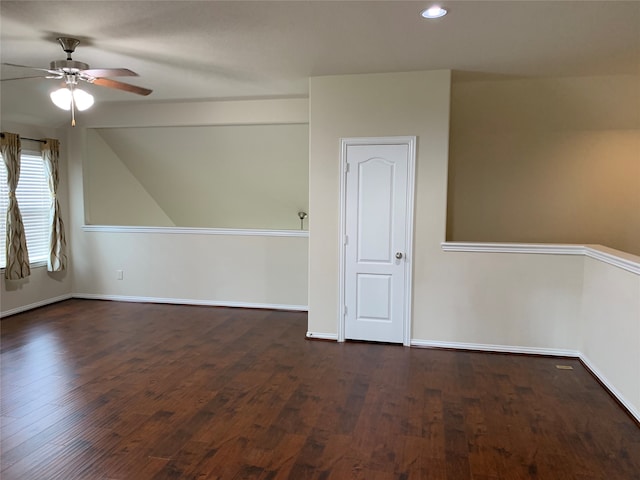 additional living space with ceiling fan, dark wood-type flooring, and vaulted ceiling