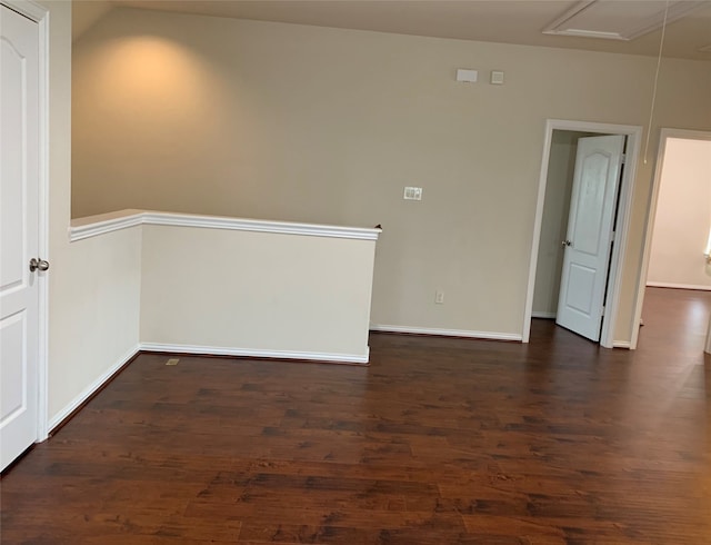 spare room with dark wood-type flooring