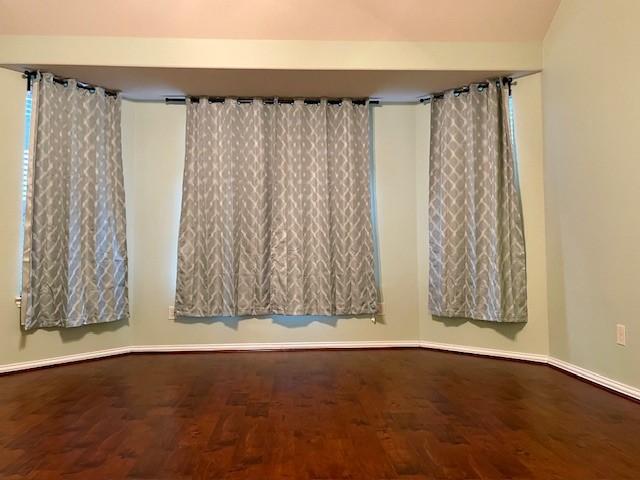 3008 Brandy Branch Ct, League City, TX 77573 - unfurnished room featuring baseboards and wood finished floors