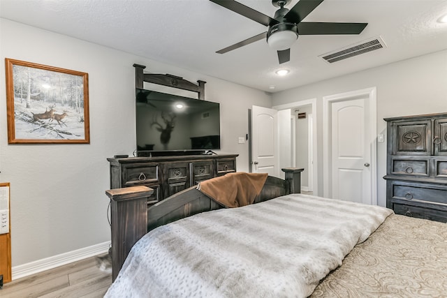 bedroom featuring ceiling fan and light hardwood / wood-style flooring