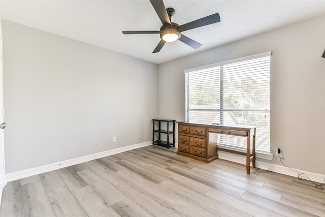 spare room with ceiling fan and light hardwood / wood-style floors