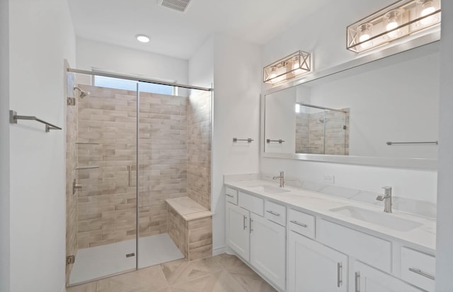 bathroom with vanity and walk in shower