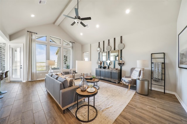 living room featuring lofted ceiling with beams and ceiling fan