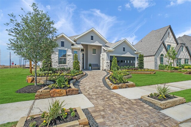 craftsman house with a garage and a front yard