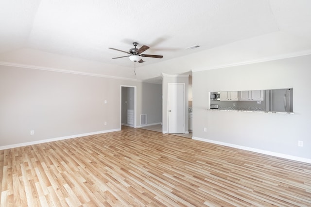 unfurnished room with ceiling fan, light wood-type flooring, and crown molding