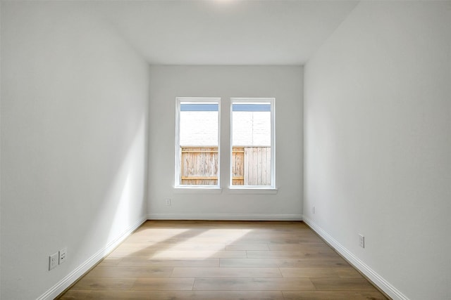 9923 Hunters Run Dr, Missouri City, TX 77459 - empty room featuring wood finished floors and baseboards