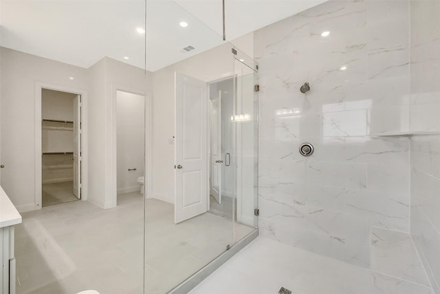 9923 Hunters Run Dr, Missouri City, TX 77459 - full bathroom featuring a marble finish shower, a walk in closet, vanity, and recessed lighting