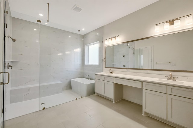 9923 Hunters Run Dr, Missouri City, TX 77459 - bathroom featuring double vanity, a freestanding tub, a marble finish shower, tile patterned flooring, and recessed lighting
