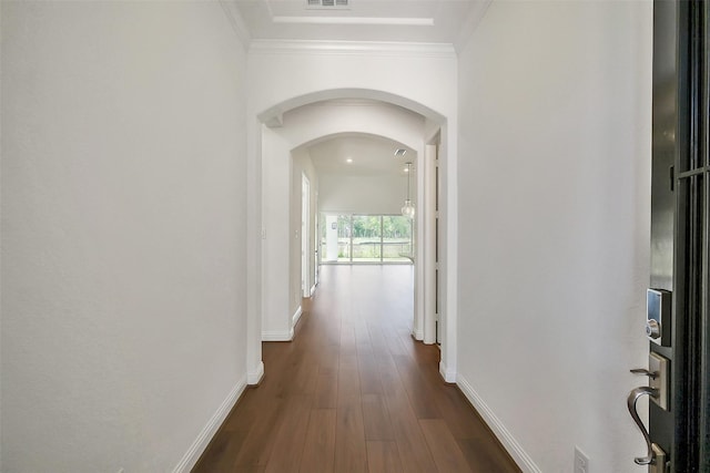 9923 Hunters Run Dr, Missouri City, TX 77459 - hall with arched walkways, dark wood-style floors, and crown molding