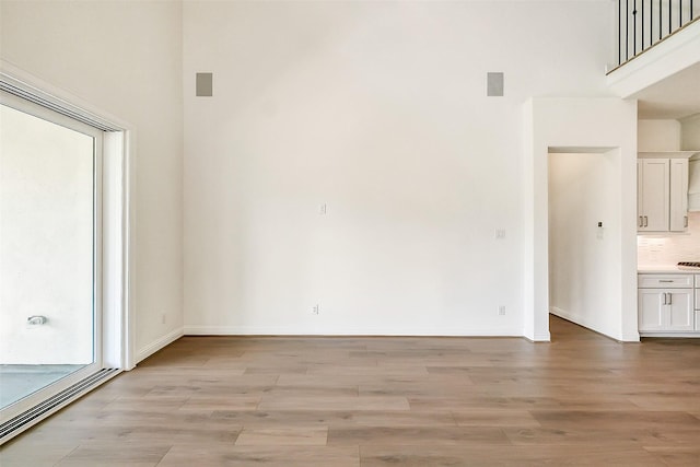 9923 Hunters Run Dr, Missouri City, TX 77459 - unfurnished living room featuring light wood-style floors