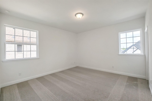 9923 Hunters Run Dr, Missouri City, TX 77459 - spare room featuring baseboards and light carpet