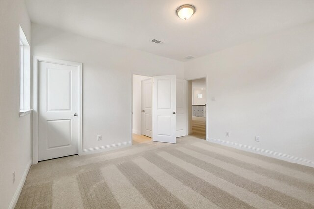 9923 Hunters Run Dr, Missouri City, TX 77459 - unfurnished bedroom with light carpet and baseboards