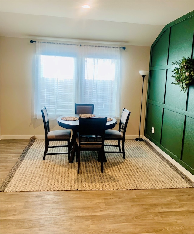 dining area with light hardwood / wood-style flooring