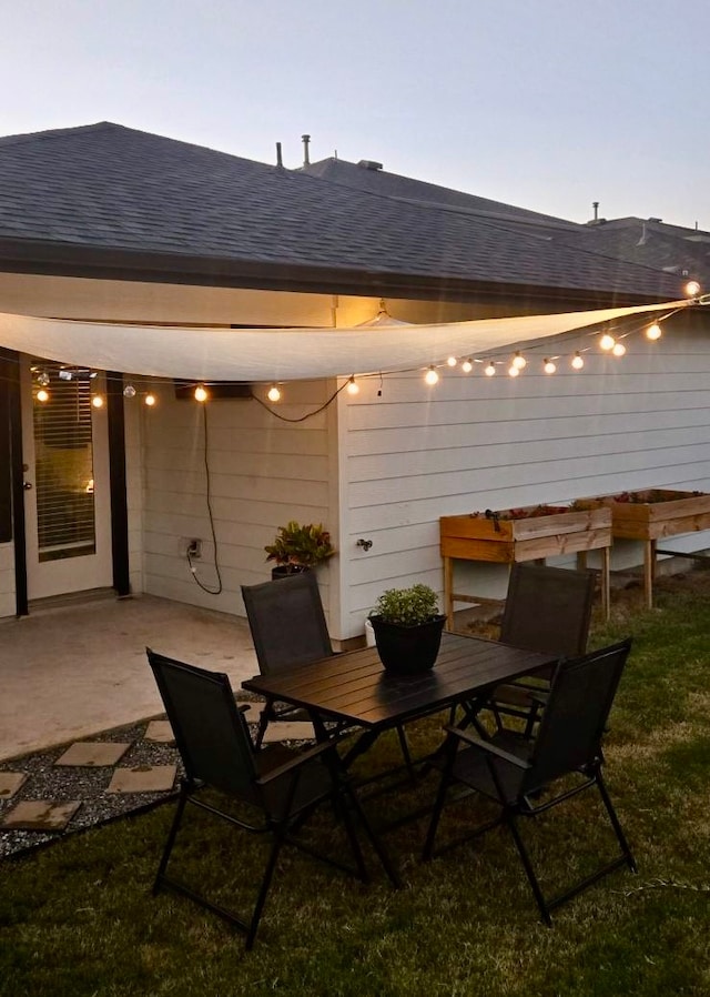 view of patio terrace at dusk