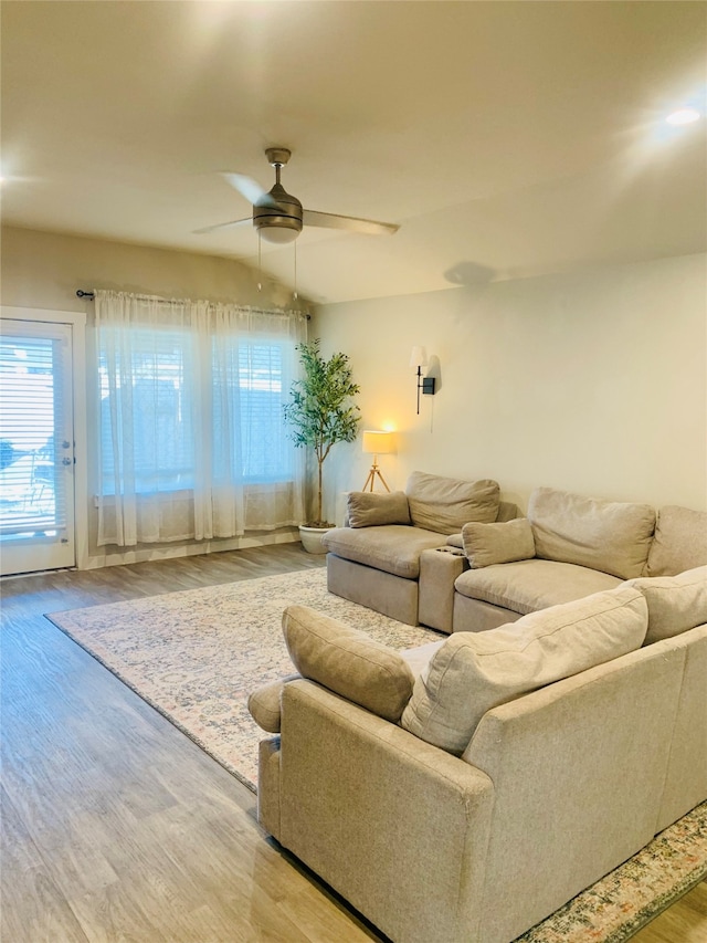 living room featuring hardwood / wood-style flooring and ceiling fan