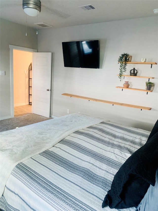 bedroom with ceiling fan and carpet floors