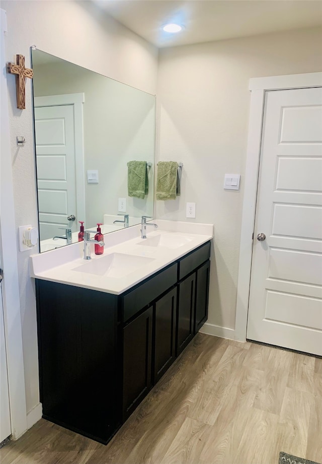 bathroom featuring vanity and wood-type flooring