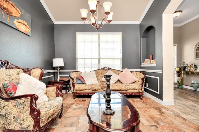 living room with a chandelier and crown molding