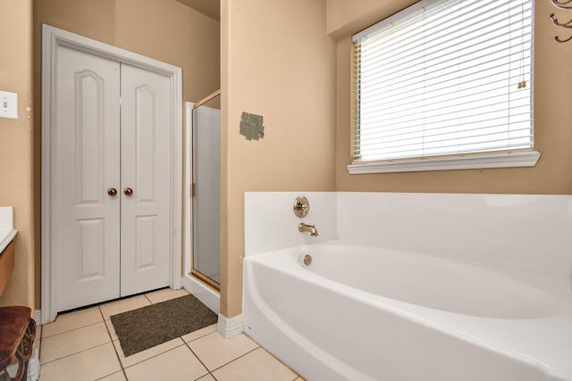 bathroom featuring vanity, separate shower and tub, and tile patterned floors