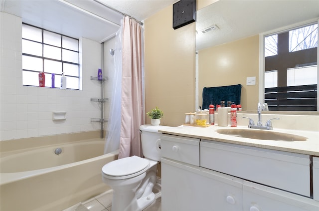 full bathroom with tile patterned floors, vanity, shower / bathtub combination with curtain, and a wealth of natural light