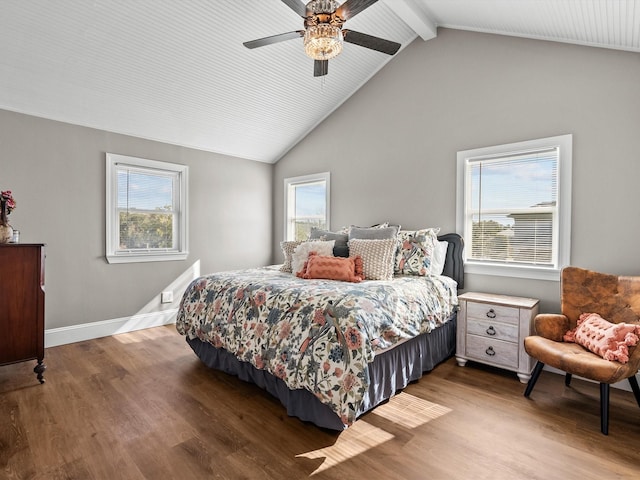 bedroom featuring hardwood / wood-style flooring, ceiling fan, and lofted ceiling with beams