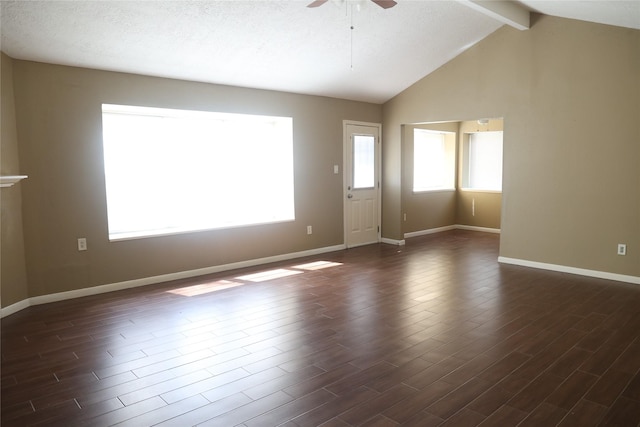 unfurnished living room with beamed ceiling, ceiling fan, dark hardwood / wood-style flooring, and a textured ceiling