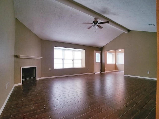 unfurnished living room featuring ceiling fan, dark hardwood / wood-style flooring, and a healthy amount of sunlight