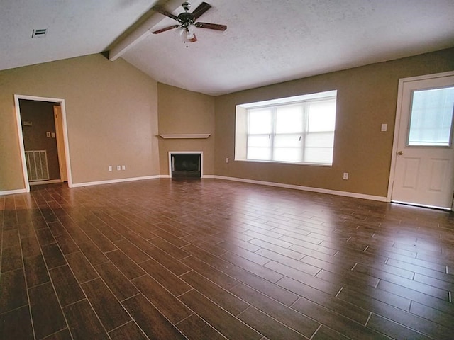 unfurnished living room with a textured ceiling, dark hardwood / wood-style flooring, lofted ceiling with beams, and ceiling fan