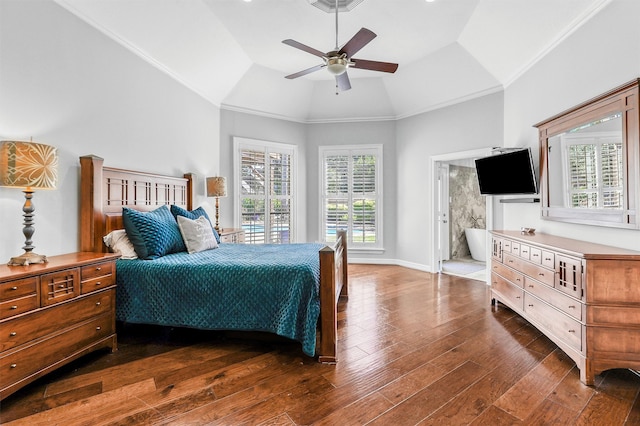 bedroom with ceiling fan, vaulted ceiling, connected bathroom, and multiple windows