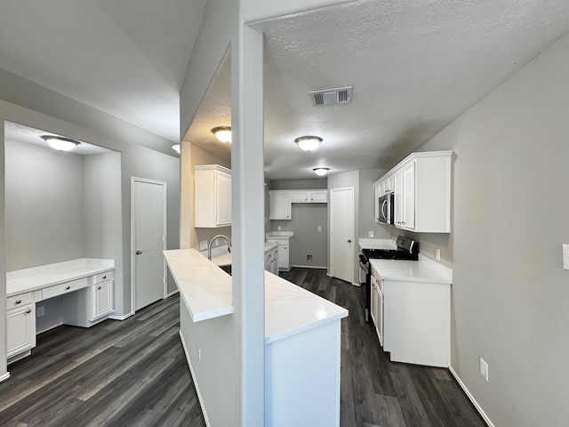 kitchen featuring white cabinets, electric range, dark hardwood / wood-style floors, light stone countertops, and a textured ceiling