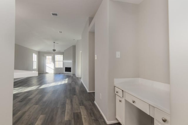 hallway with dark hardwood / wood-style floors