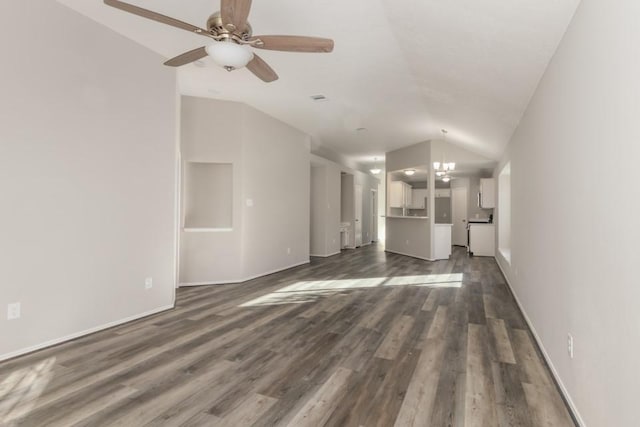 unfurnished living room with lofted ceiling, ceiling fan with notable chandelier, and dark hardwood / wood-style floors