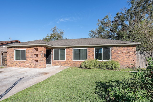 ranch-style home with a patio and a front lawn