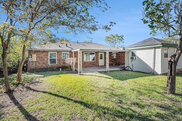 back of property featuring a patio area, a yard, and cooling unit