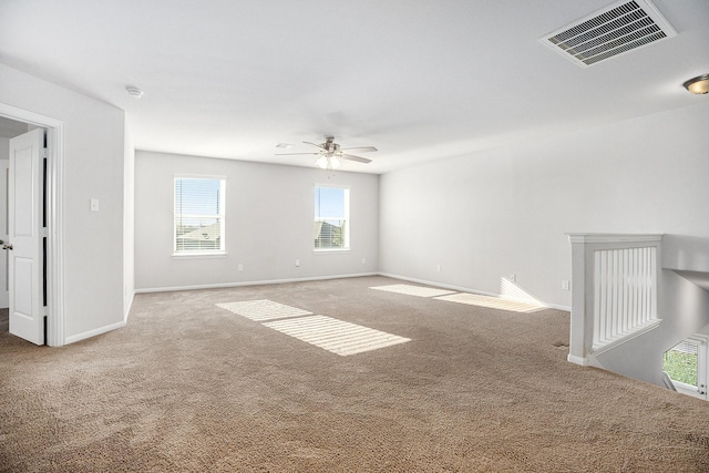 unfurnished room with ceiling fan and carpet floors