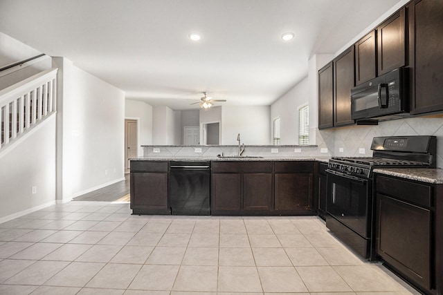 kitchen with black appliances, sink, ceiling fan, dark brown cabinets, and kitchen peninsula