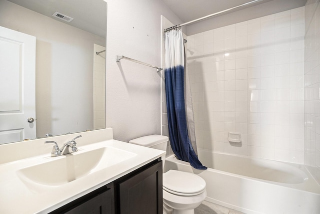 full bathroom with tile patterned flooring, shower / bath combo with shower curtain, vanity, and toilet