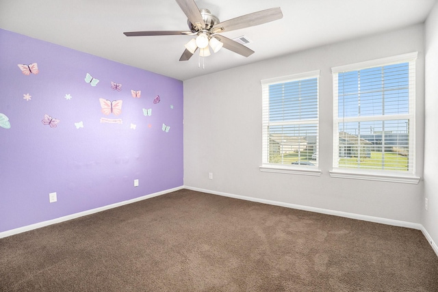 spare room with carpet and ceiling fan