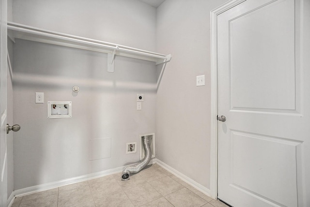 washroom featuring electric dryer hookup, gas dryer hookup, hookup for a washing machine, and light tile patterned floors