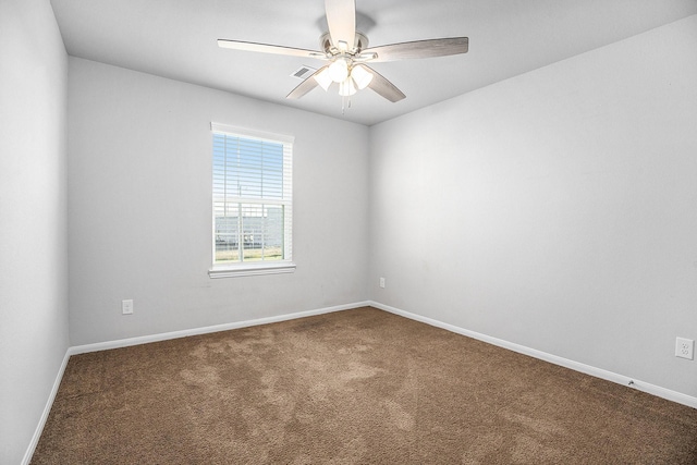 carpeted empty room featuring ceiling fan