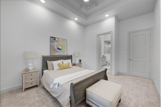 carpeted bedroom featuring ceiling fan, ornamental molding, and ensuite bath