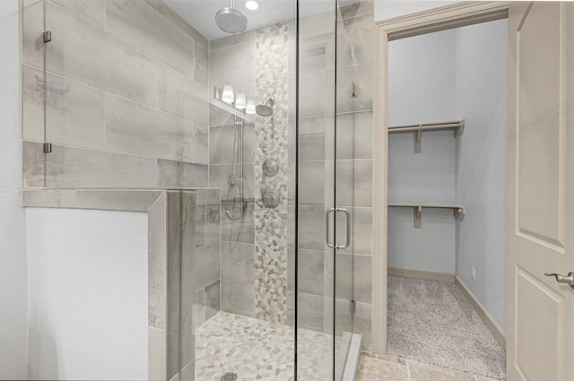 bathroom featuring an enclosed shower